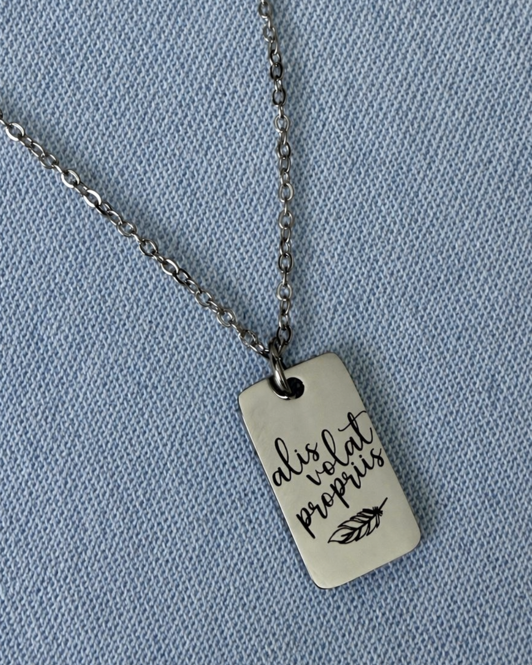 She flies with her own wings: "alis volat propriis" Pendant